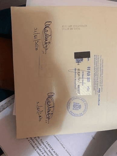 Nigerian police character certificate bearing a Spanish Consulate General in Lagos legalization stamp and official signatures.